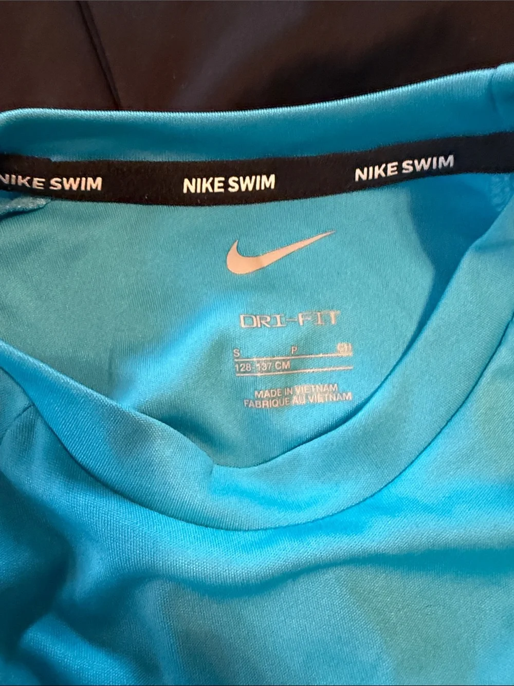 Two sets, Nike rash guard/swim shorts, size small (boys 8-10)